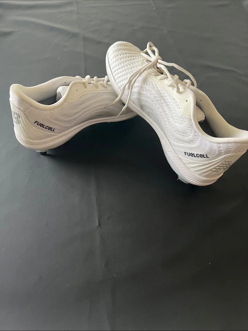 New Balance White Baseball Cleats with Black Logo